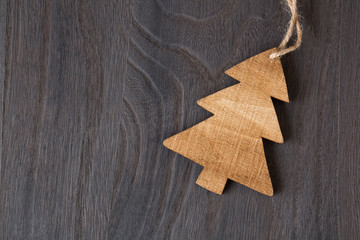 Wooden christmas tree on wooden background
