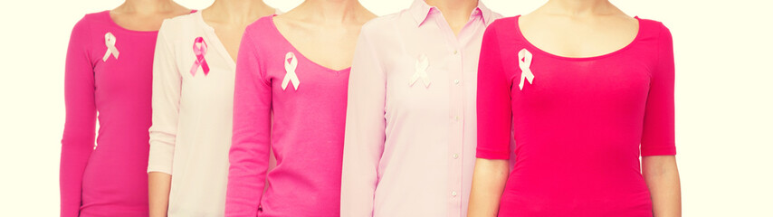 close up of women with cancer awareness ribbons