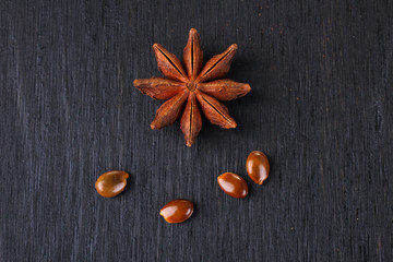  Star anise on grey wooden background