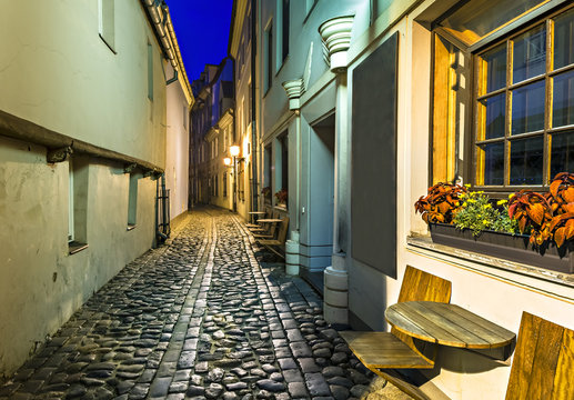 Narrow medieval street, night photo performed in old Riga city, Latvia