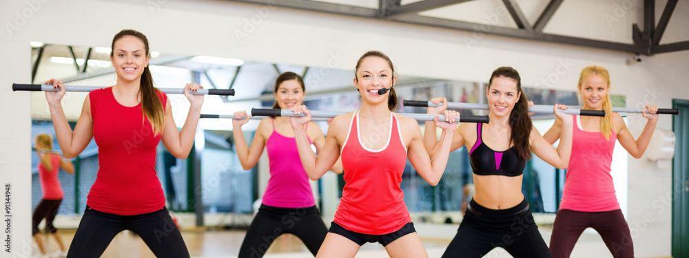 Canvas Prints group of smiling people working out with barbells