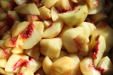 Sliced peaches. Cooking of peach jam or marmalad