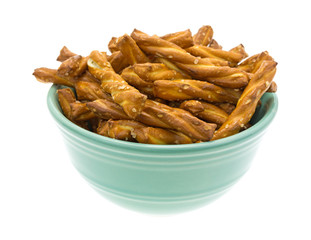 Small bowl filled with braided pretzel sticks