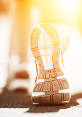 Athlete runner feet running on treadmill.closeup on shoe