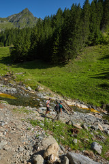 Fototapeta na wymiar Hikers on a mountain trail