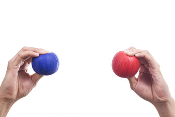 Hands of a woman squeezing a stress balls
