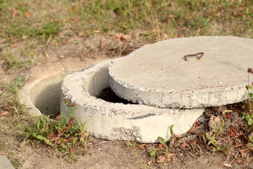 Exposed concrete manhole