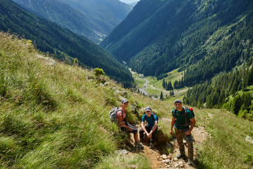 Fototapeta premium Group of hikers on a mountain trail