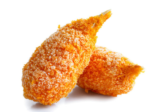 Two Frozen Breaded Surimi Crab Claws In Perspective, Isolated On