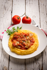 cod with tomato sauce and porridge