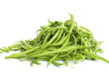 pile of green beans on a white background