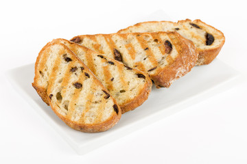 Toasted Kalamata Bread - Crusty black olive bread sliced and grilled.
