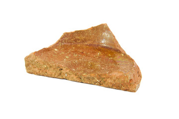 Archeological sherd fragment of ancient pottery isolated on a