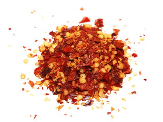 crushed red pepper, dried chili flakes and seeds isolated on white background