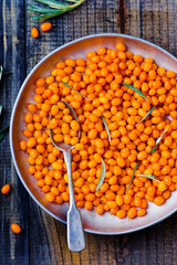berries of an organic sea-buckthorn in a basket