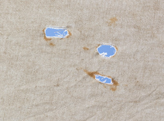 a hole in the fabric of the old against the blue sky