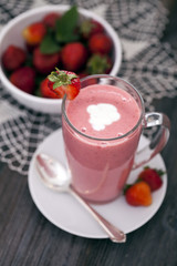Delicious dessert protein with strawberries. Yogurt in a glass