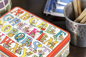 Close-up of small box decorated with drawings for childhood vocabulary learning