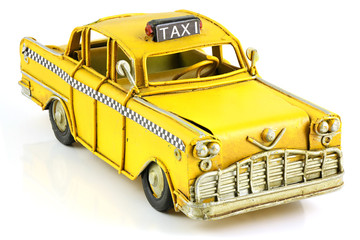Old toy yellow taxi
