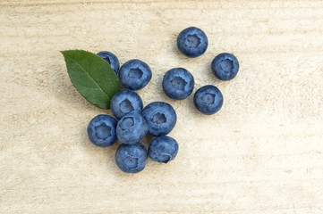 Fresh blueberries on a wooden table.