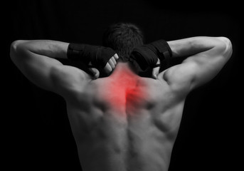 Fototapeta na wymiar Pain in back.Sport injury or another pain concept