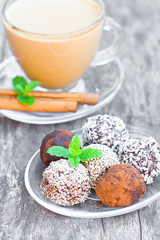 Assorted dark chocolate truffles with cocoa powder