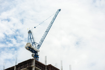 Fototapeta na wymiar Construction crane on tower