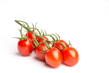 Tasty and fresh cherry tomatoes on a vine