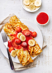 Crepes with strawberries and banana