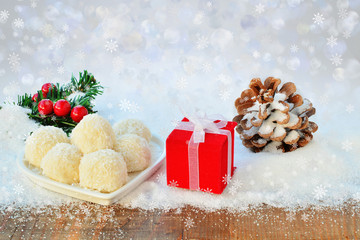 Christmas background with lights gift and pine cone