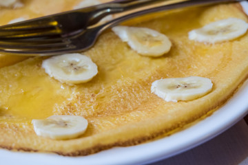 pancakes with banana and syrup