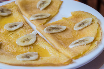 pancakes with banana and syrup