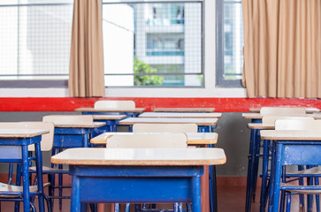 Kid desks in elementary classroom