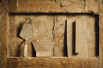 old  hand tools on antique wooden panel