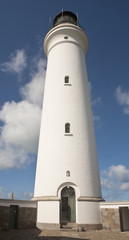 Looking Up. An image looking up a grand old lighthouse emphasizing it height and style.