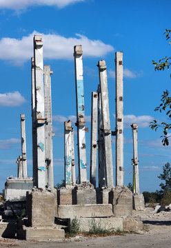 Concrete pillars at abandoned construction site 