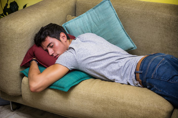 Drunk Young Man Sleeping on the Living Room Couch