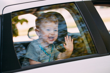 Adorable baby boy in the car