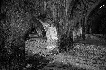 The interior of the shipyard (Tersane) in the ruins of a medieval fortress (Alanya Castle). Alanya. Turkey. Black and white.