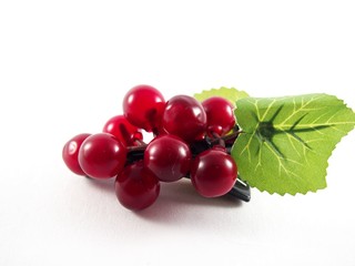 Purple plastic grape fruit shape on black hairpin, decorated with artificial green leafs, hair accessory, isolated on white background