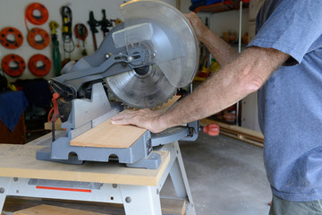 Man Cutting Wood with Table Saw
