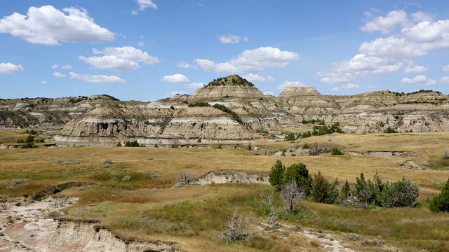 Camera pans across a view  overlooking the badlands in Theodore Roosevelt National Park in North Dakota, USA.