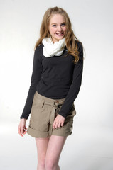 portrait of young woman in shorts with scarf posing