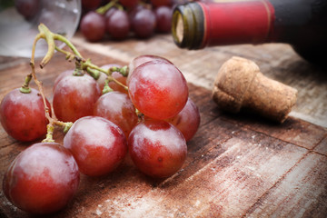 Red wine and grapes in vintage setting