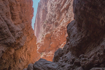 Way out of dark red canyon into the light