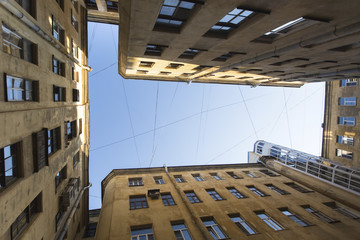 View from the bottom up in court yard-wells in the historic center of St. Petersburg, Russia.