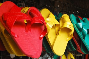 Colored slippers hanging for sale photo