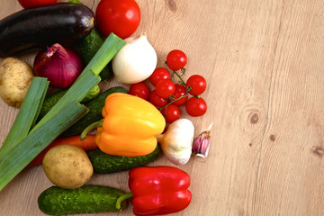 Pile of organic vegetables on a rustic wooden table