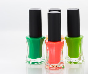 Group of bright nail polishes on white