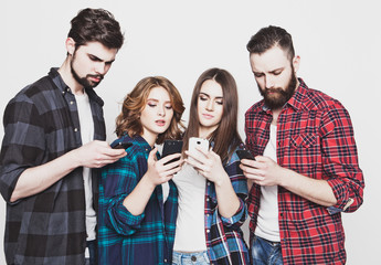young people  looking at their phones